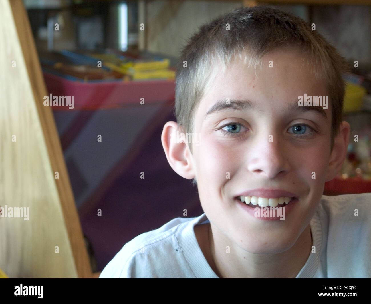 Closeup of a youg boy with big eyes and a big smile Stock Photo