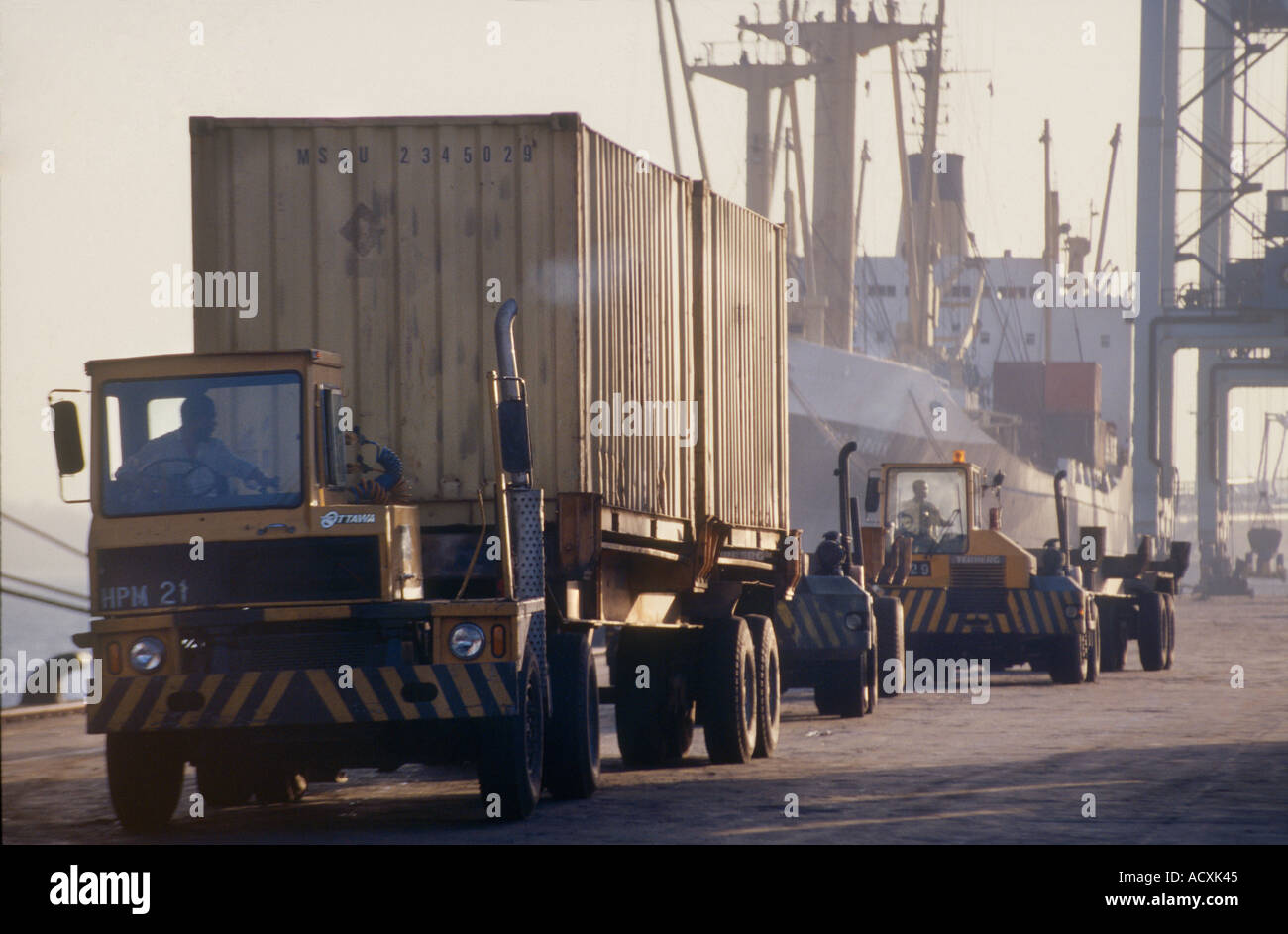 Trucks delivering containers to Cargo Ship Mombasa Ports Kenya Stock