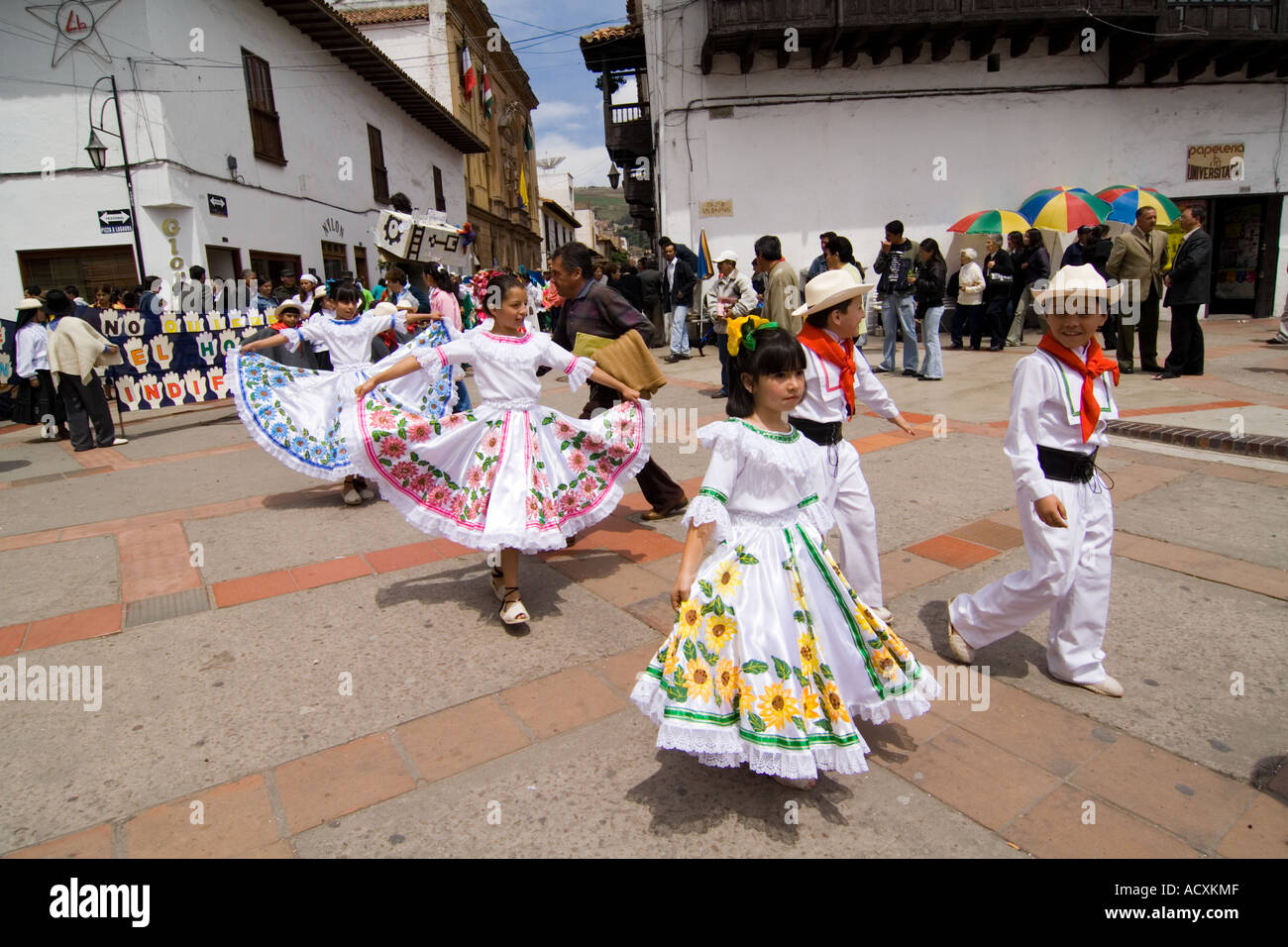 children as traditional cumbia dancers during a masquerade in the street, Tunja, Boyacá, Colombia, South America Stock Photo