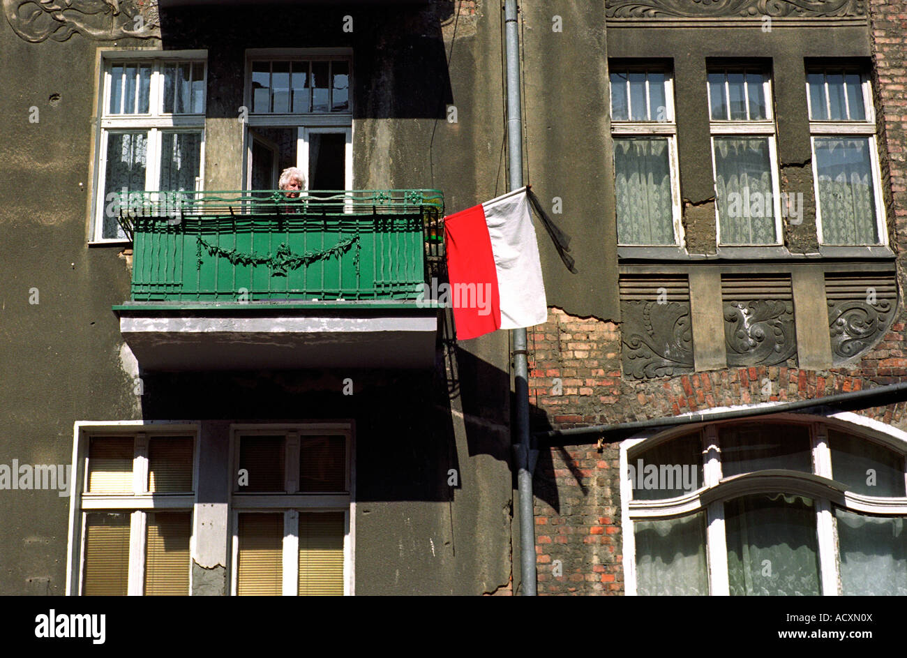 Polish flag with black ribbon on a balcony after the death of Pope John Paul II, Poznan, Poland Stock Photo
