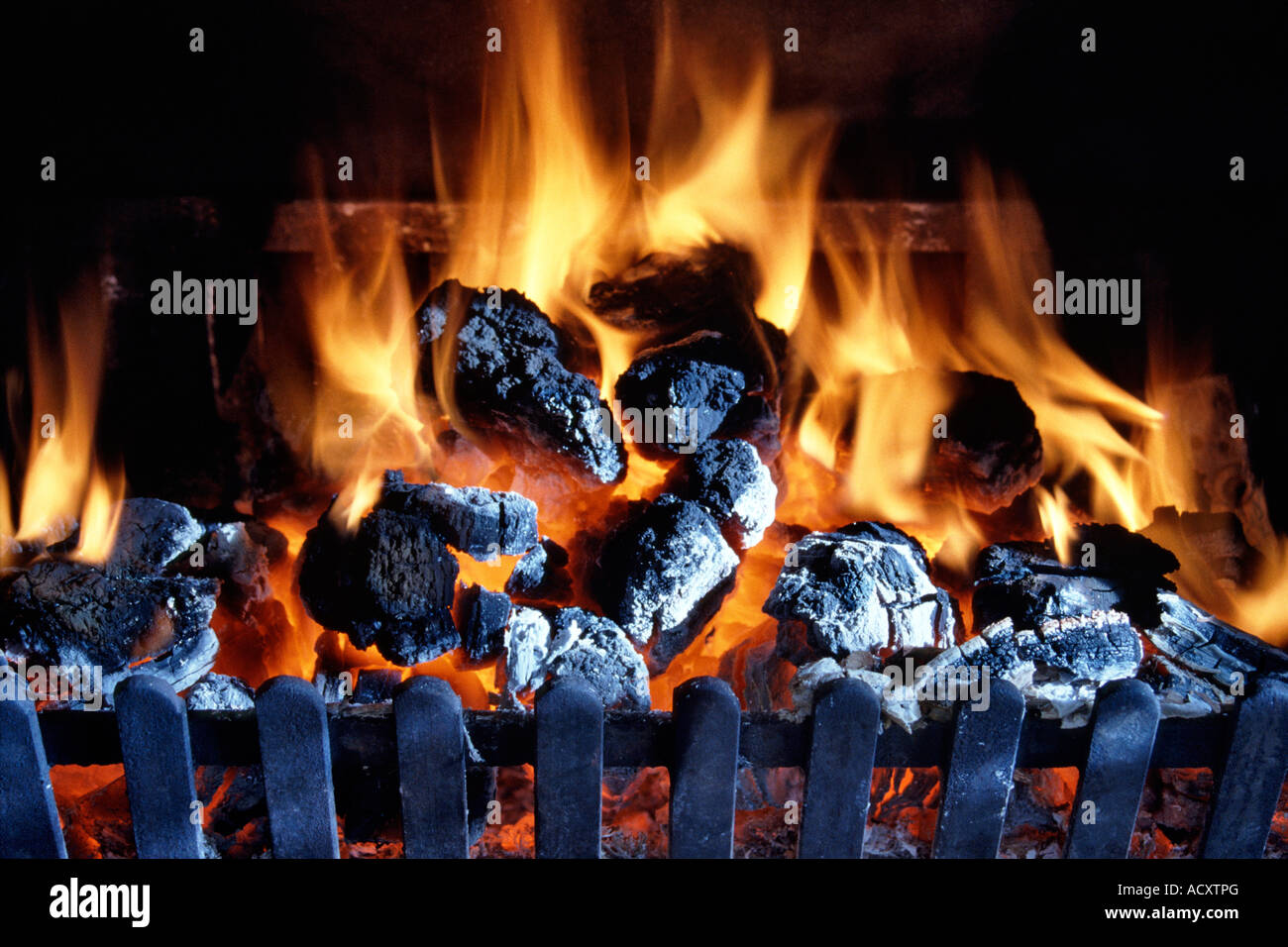 A coal fire burning in a domestic fireplace. This image was formerly