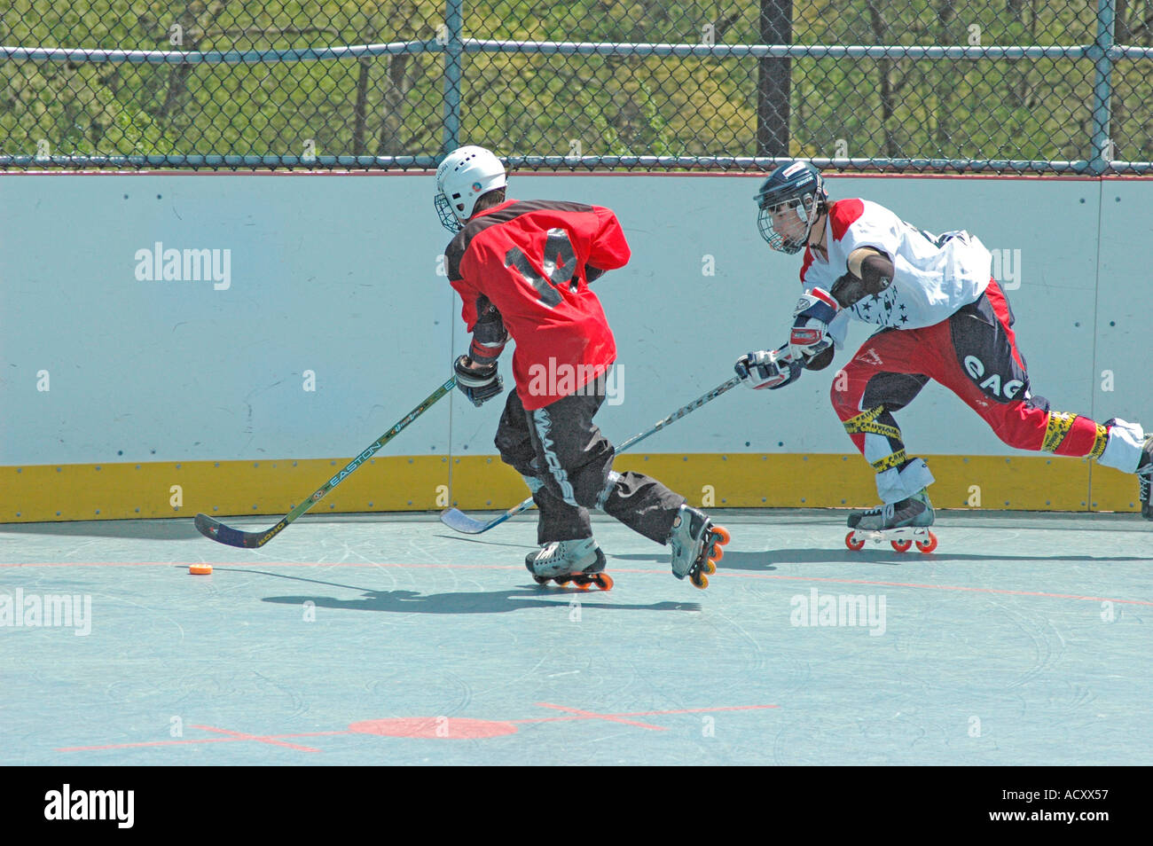 Game on inline skates of Roller Hockey between local teams without Ice  Hockey option in a warm weather area of USA America global warming Stock  Photo - Alamy