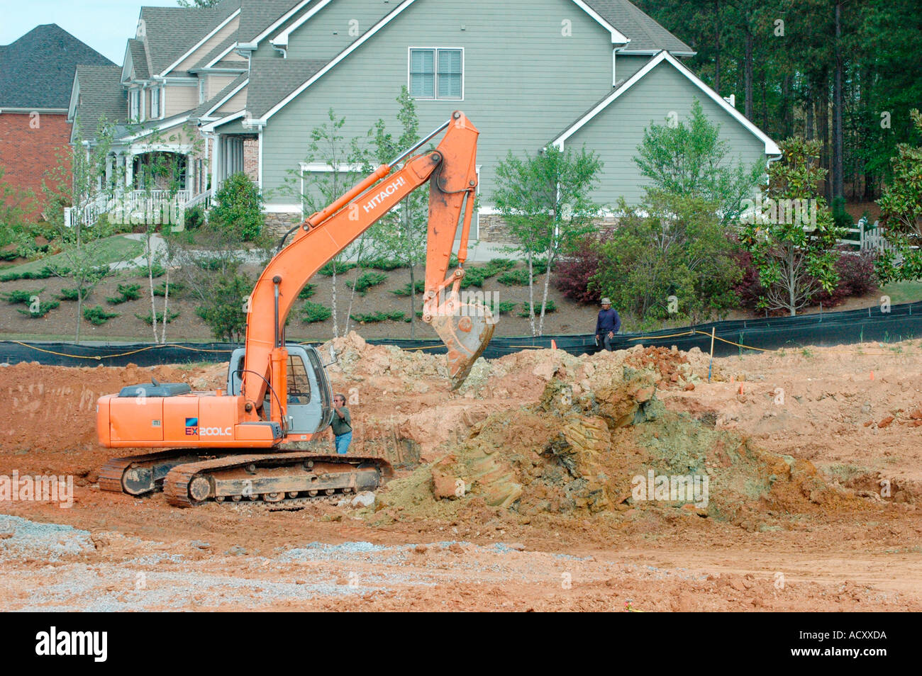 Digging foundations of office building and french drains with track