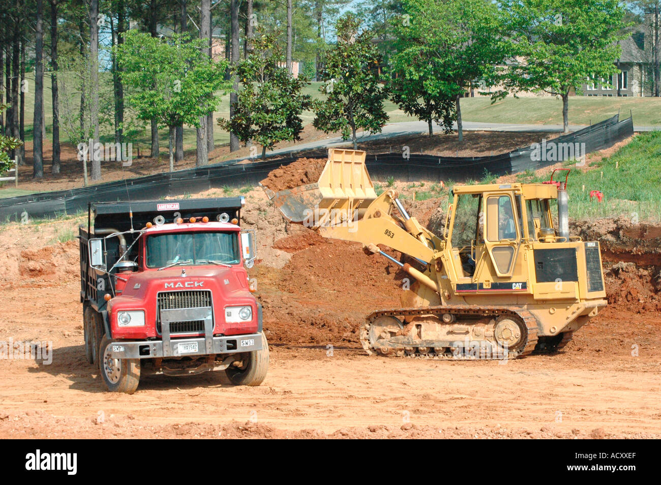 Digging foundations of office building and french drains with track