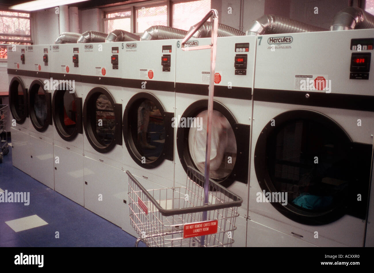 Dryers in a laundry room Stock Photo Alamy