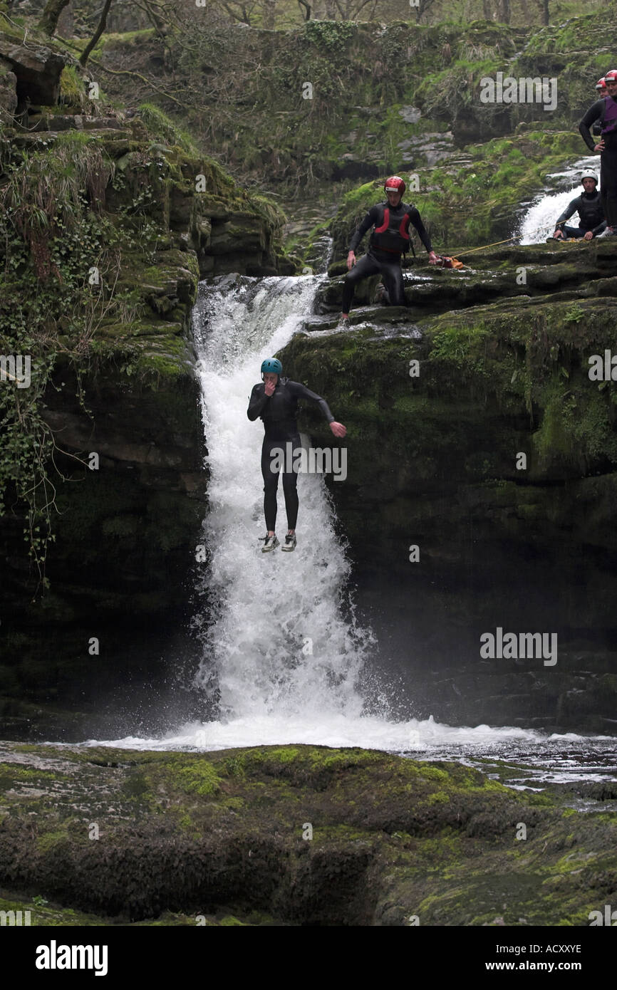 Gorge Walking at  Sgwd Clun Gwyn waterfall Brecon Wales Stock Photo