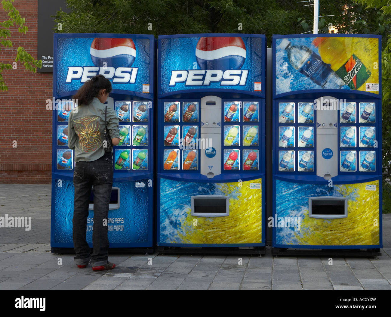 Young woman at a Pepsi vending machine, Toronto, Canada Stock Photo