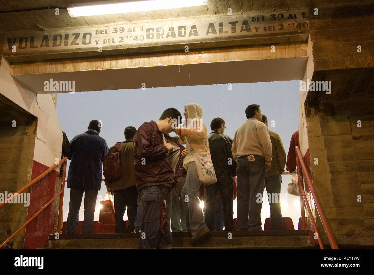 People inside the Sanchez Pizjuan Stadium on a rainy night, Seville, Spain Stock Photo