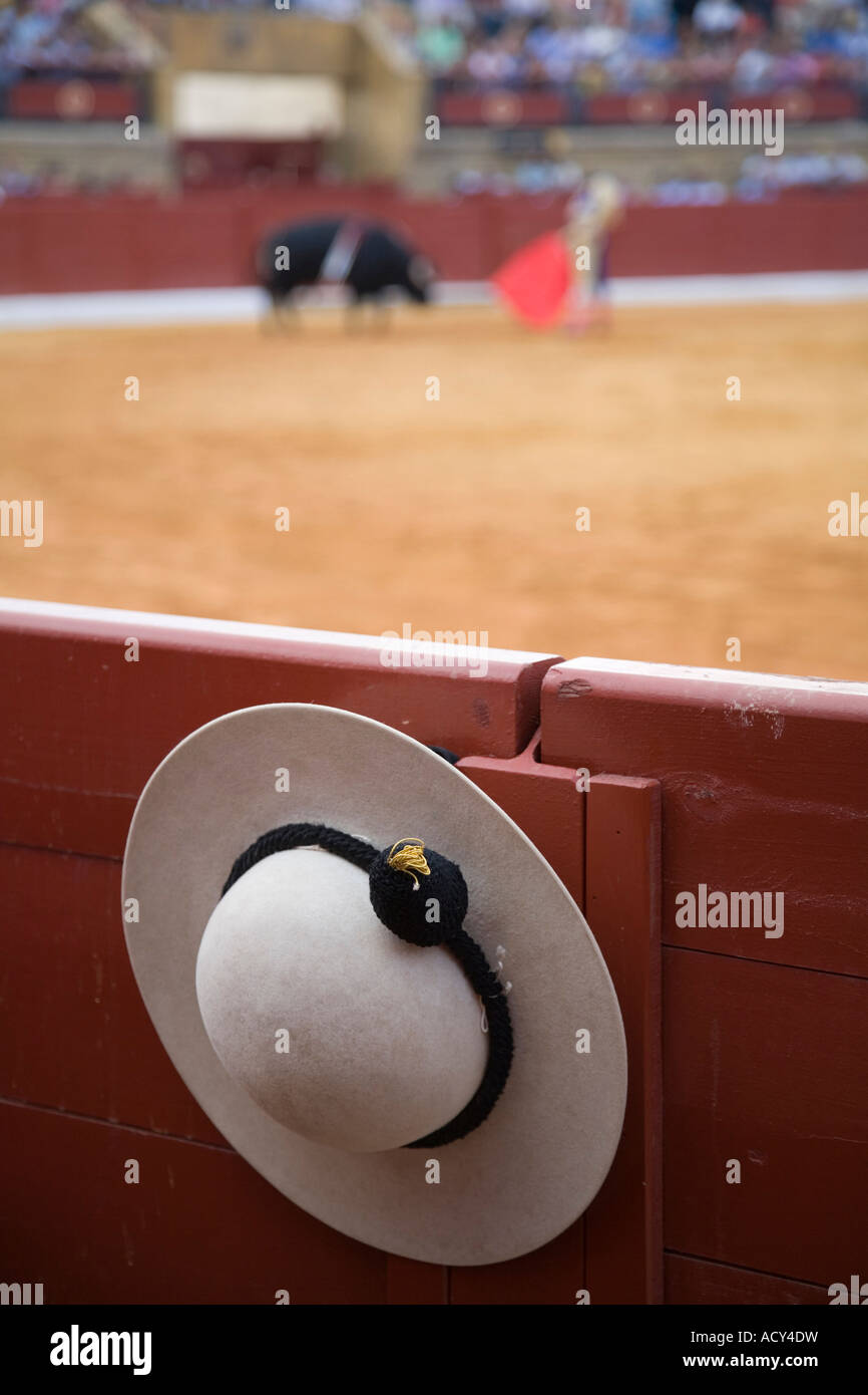 A castoreno (The rounded picadors hat) hanging from the barrier during a bullfight, Spain Stock Photo