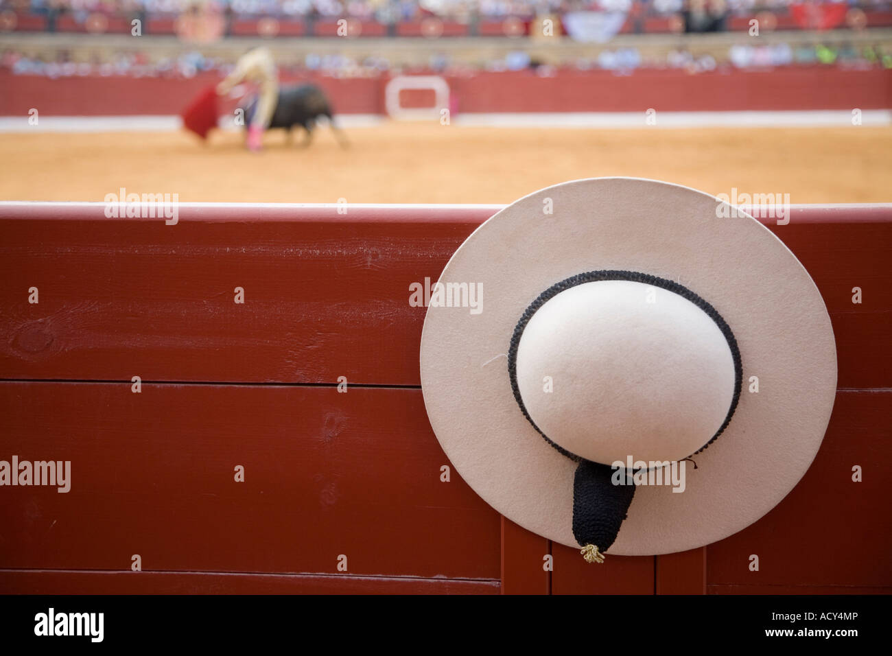 A castoreno (the rounded picadors hat) hanging from the barrier during a bullfight, Spain Stock Photo
