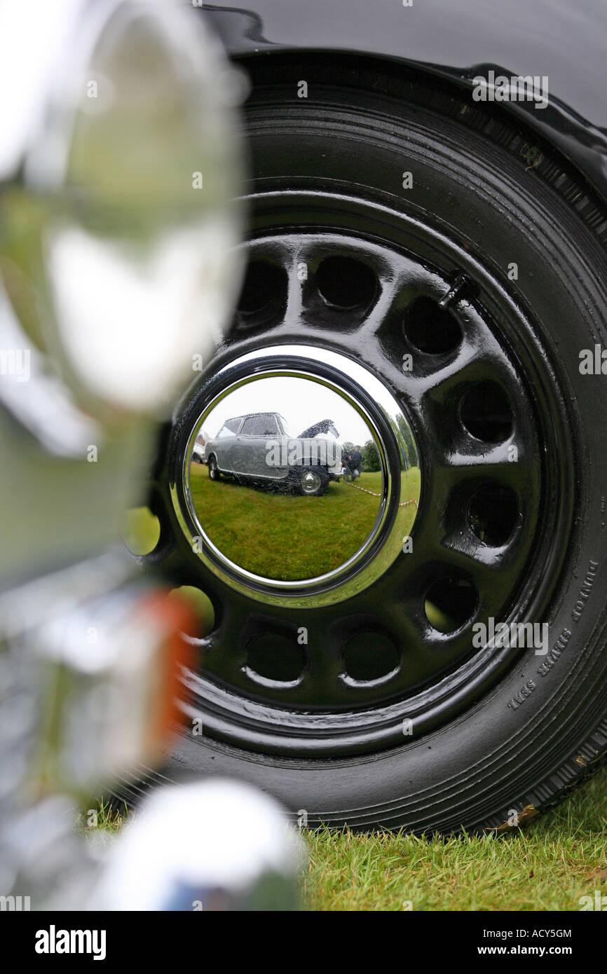 Reflections of old Leyland Mini in old chrome hub cap of vintage car show at Fyvie Castle, Aberdeenshire, Scotland, UK Stock Photo