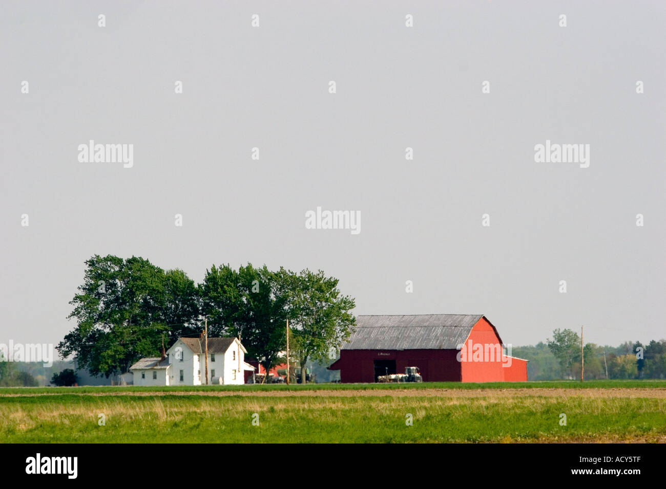 Red barn and farm in the plains of Northwest Ohio. Stock Photo