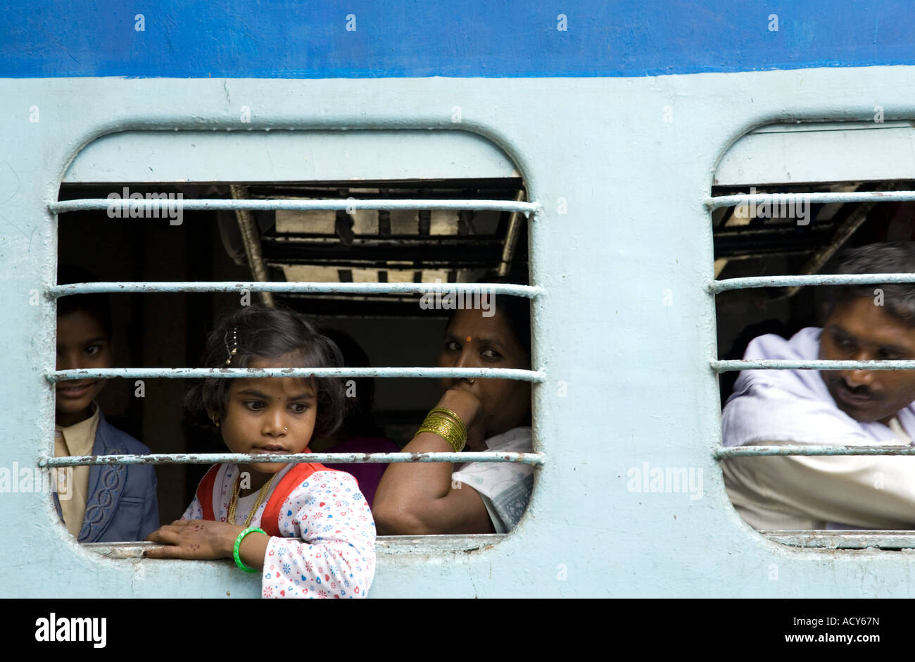 Passengers looking through the window. Train Gorakhpur to Varanasi