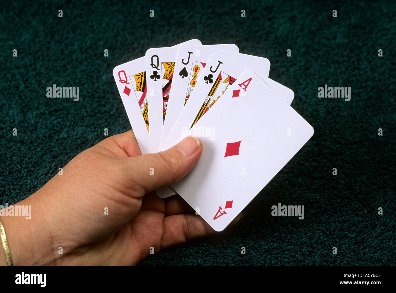A poker hand of playing cards showing two pair Stock Photo Alamy