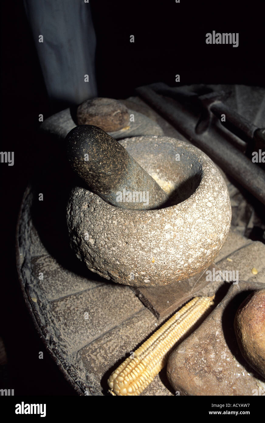 Native American Indian mortar and pestle used to grind corn Stock Photo
