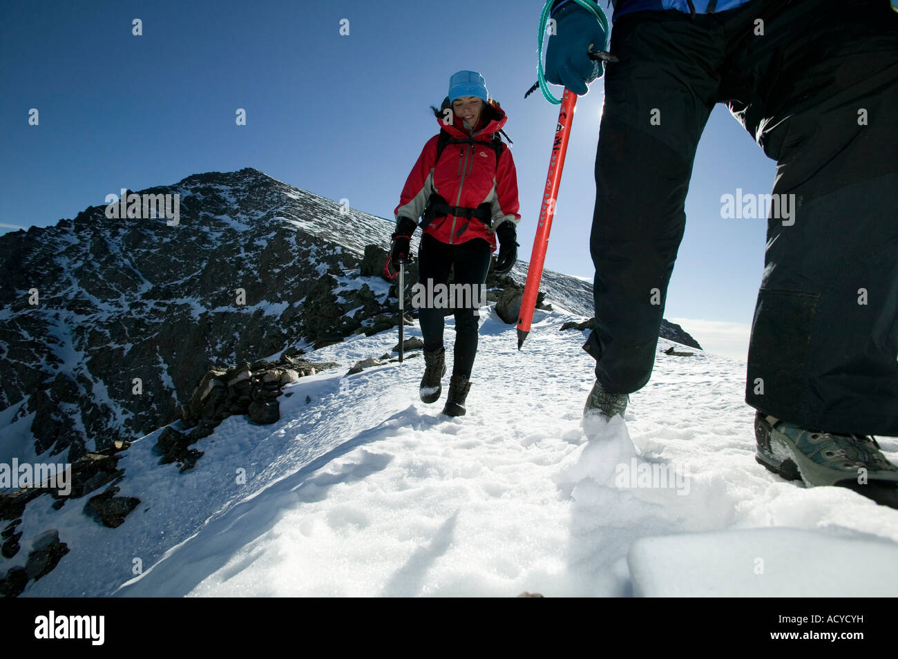 Hikers decending from summit of Mulhacen Sierra Nevada Spain Stock Photo