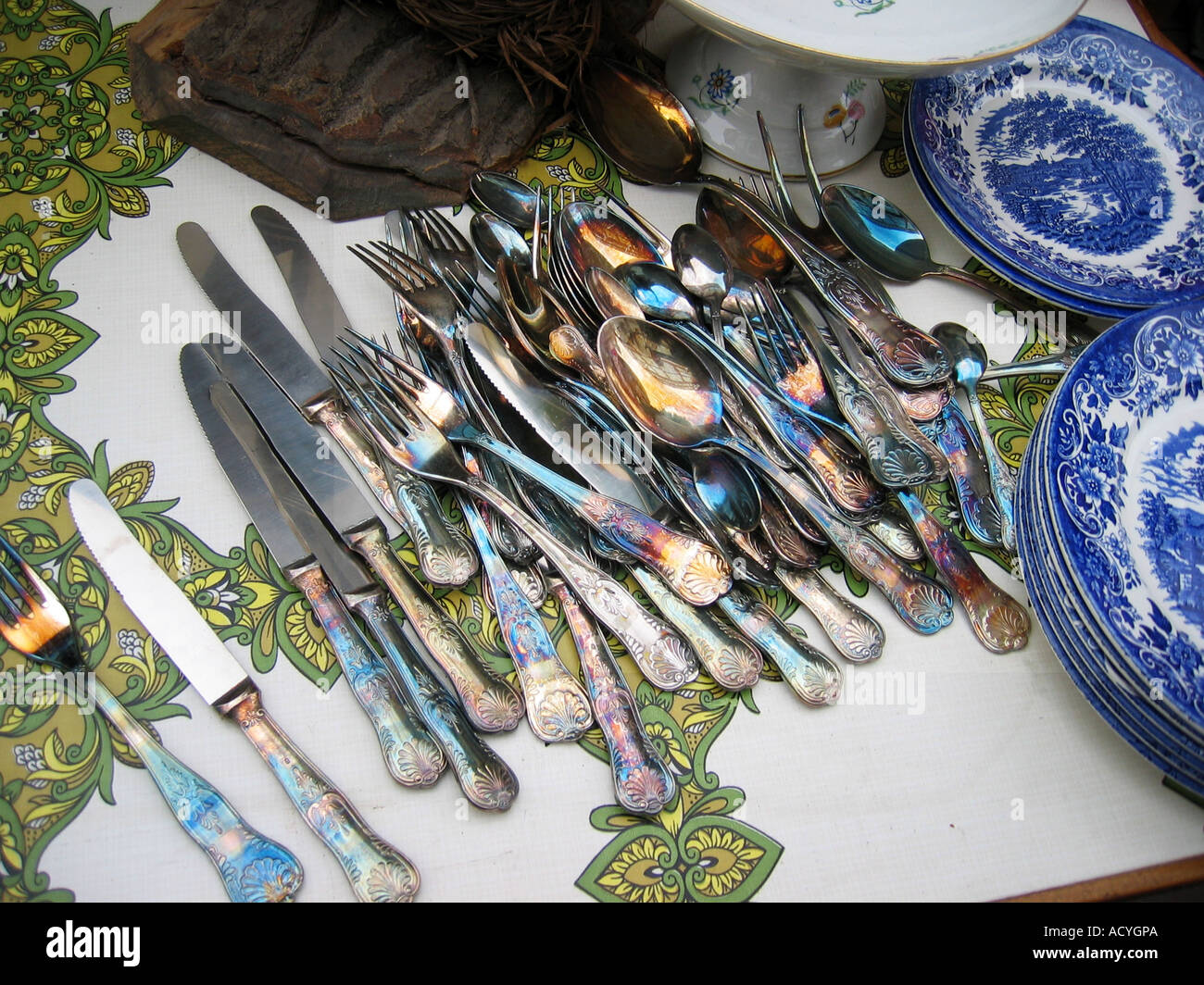 collection of decorative silverware and plates at flee market England Stock Photo