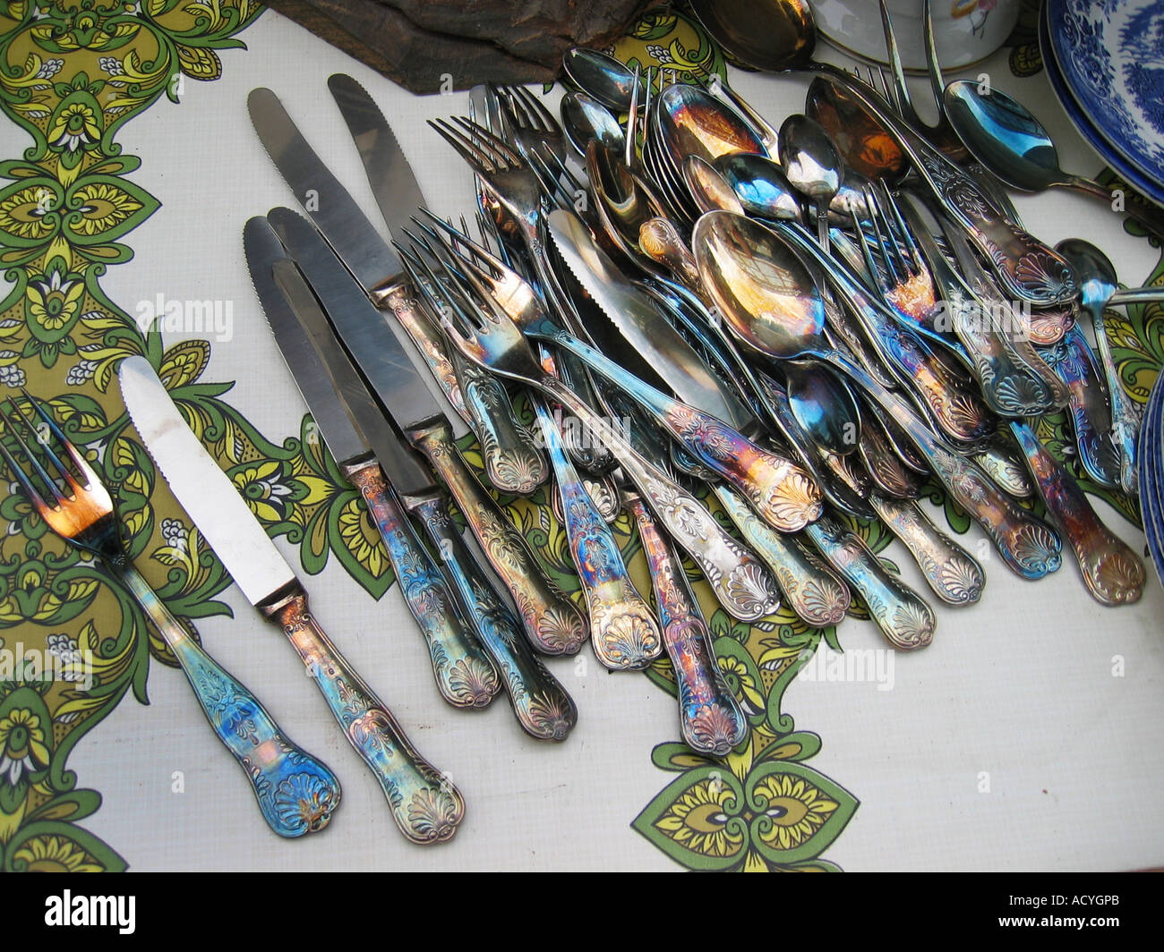 collection of decorative silverware at flee market England Stock Photo