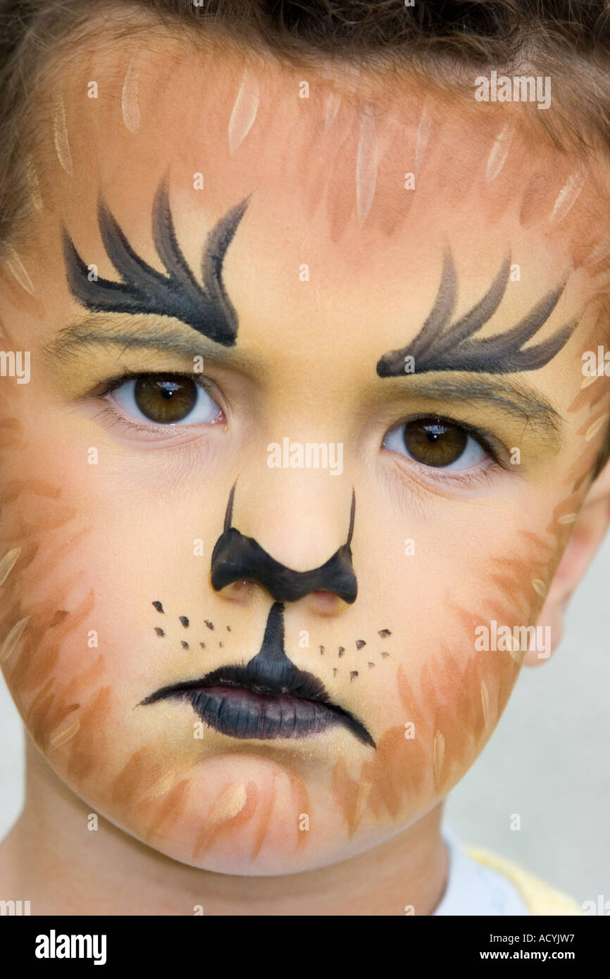 Little boy wearing tiger or lion face paint Stock Photo - Alamy