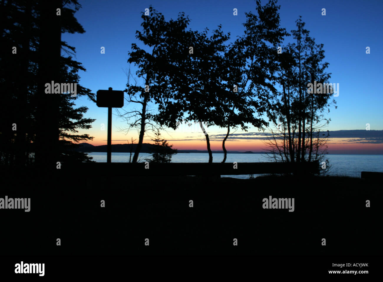 Silhouettes against Lake Superior sunset. Stock Photo