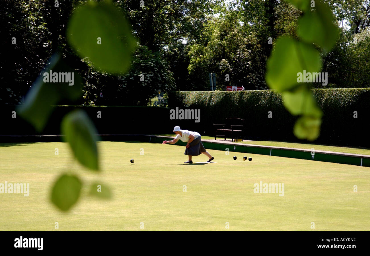A lady plays bowls at Arundel Bowls Club in West Sussex Stock Photo