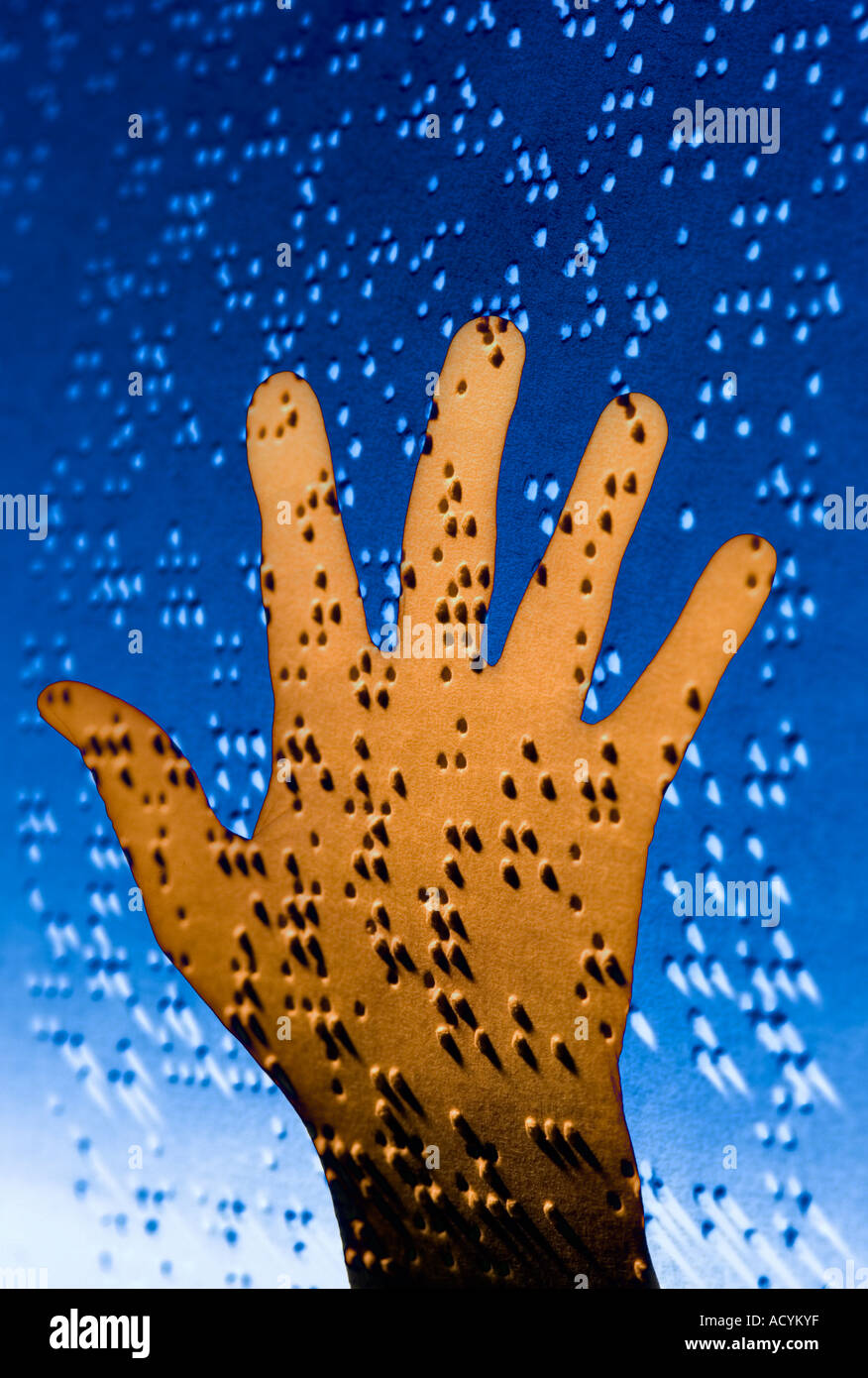 conceptual view of a human hand composited on sheet of Braille text for the blind Stock Photo