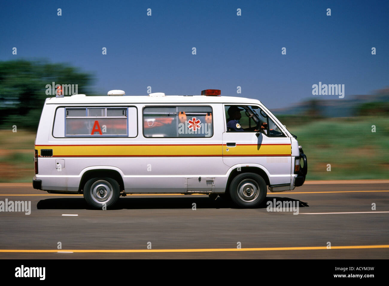 An ambulance speeds along a road in South Africa Stock Photo Alamy