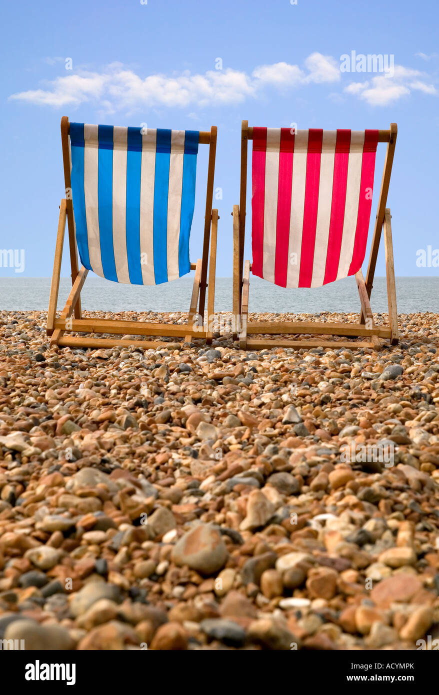 Two deckchairs on a pebble beach low perspective Stock Photo - Alamy