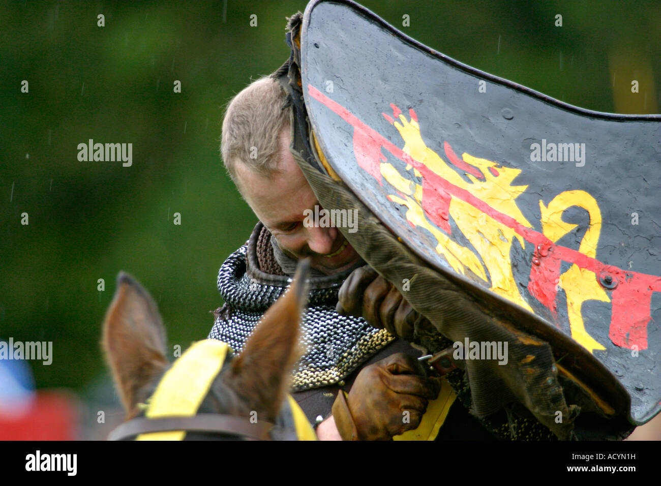 The Black knight during the Robin Hood Pageant at Nottingham Castle City of Nottingham East Midlands UK. The joust is one of the highlights of the annual celebration of Notttinghams most famous hero Oh yes, its raining... Stock Photo