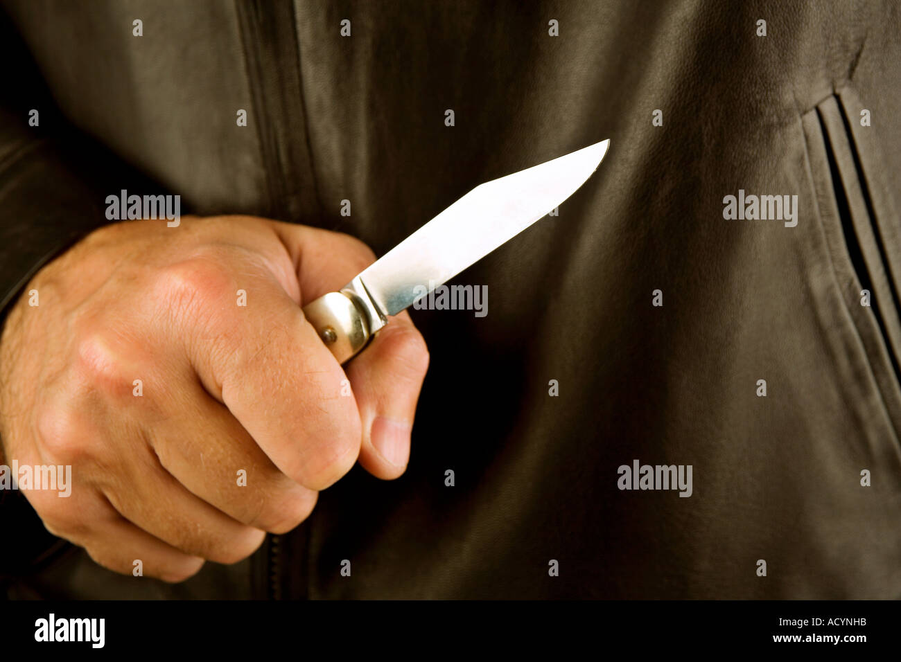 Man holding a flicknife Stock Photo
