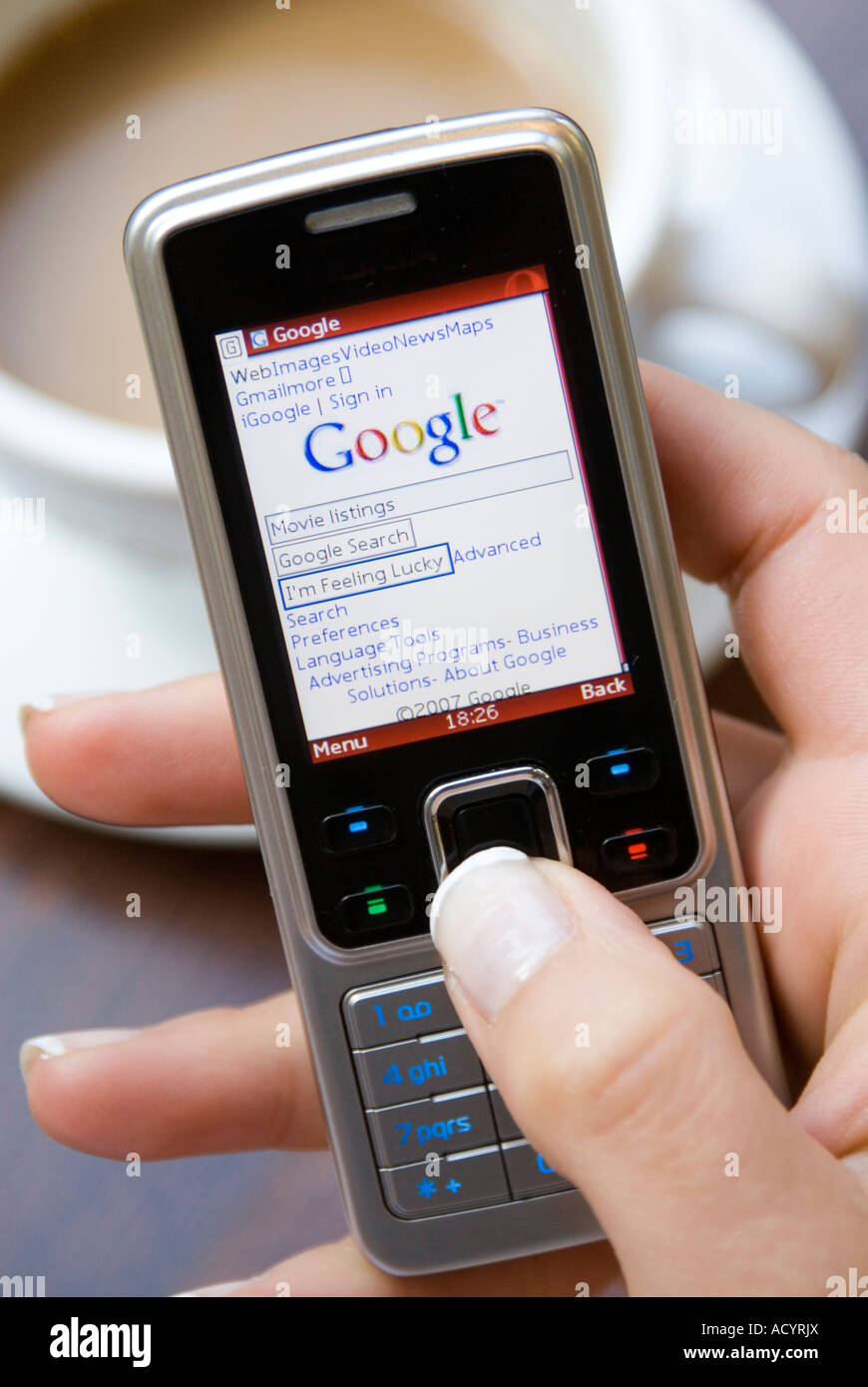 Browsing Google Internet website on Nokia mobile phone Stock Photo