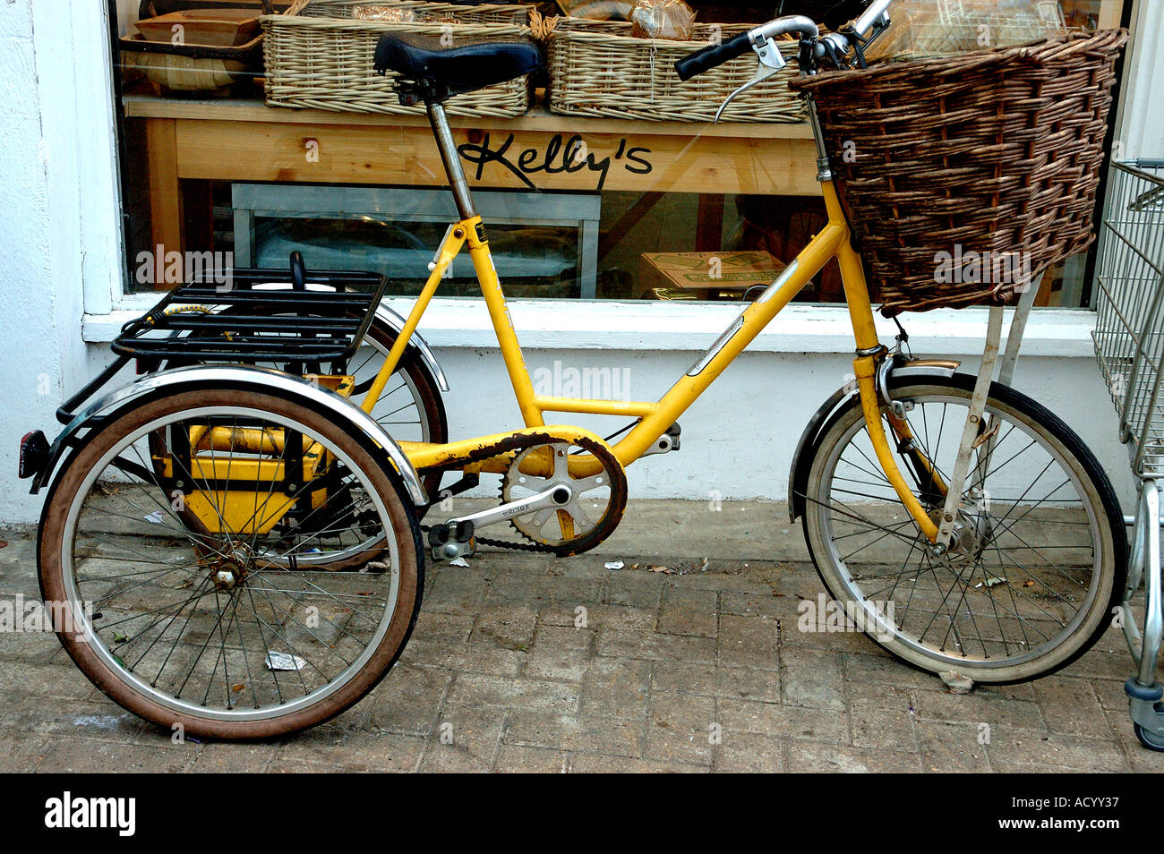 Old fashioned bike outside Grocery Store in Northcote Road Market Clapham Stock Photo