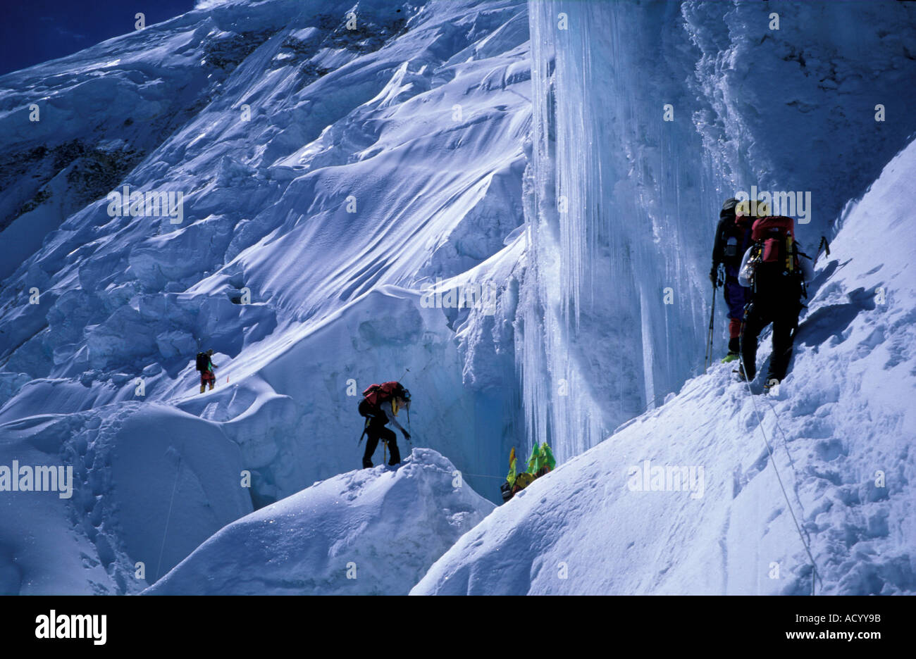 Climbers on Manaslu glacier crossing Stock Photo