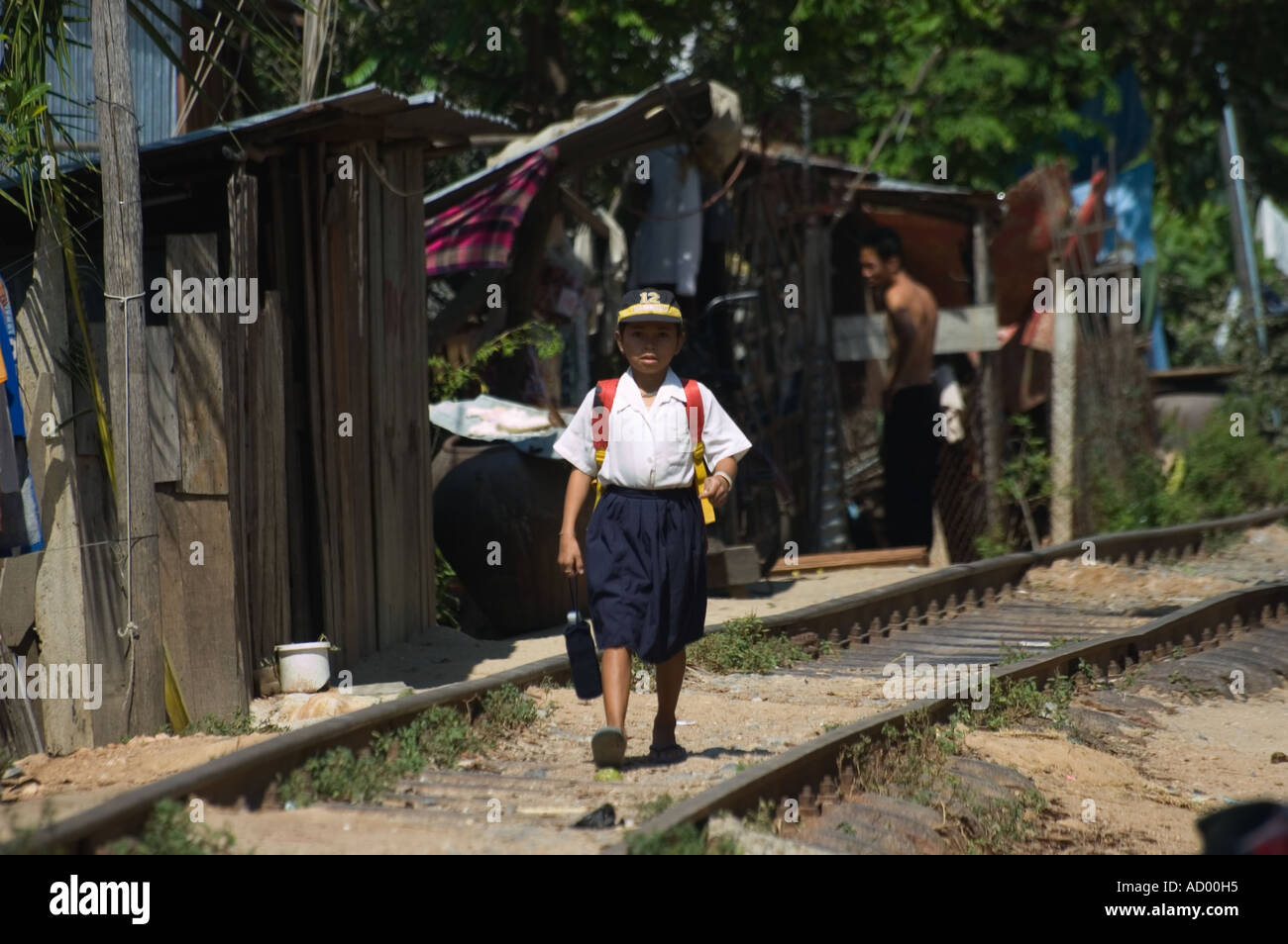 child on train tracks street life in slums Phnom Penh Cambodia South ...