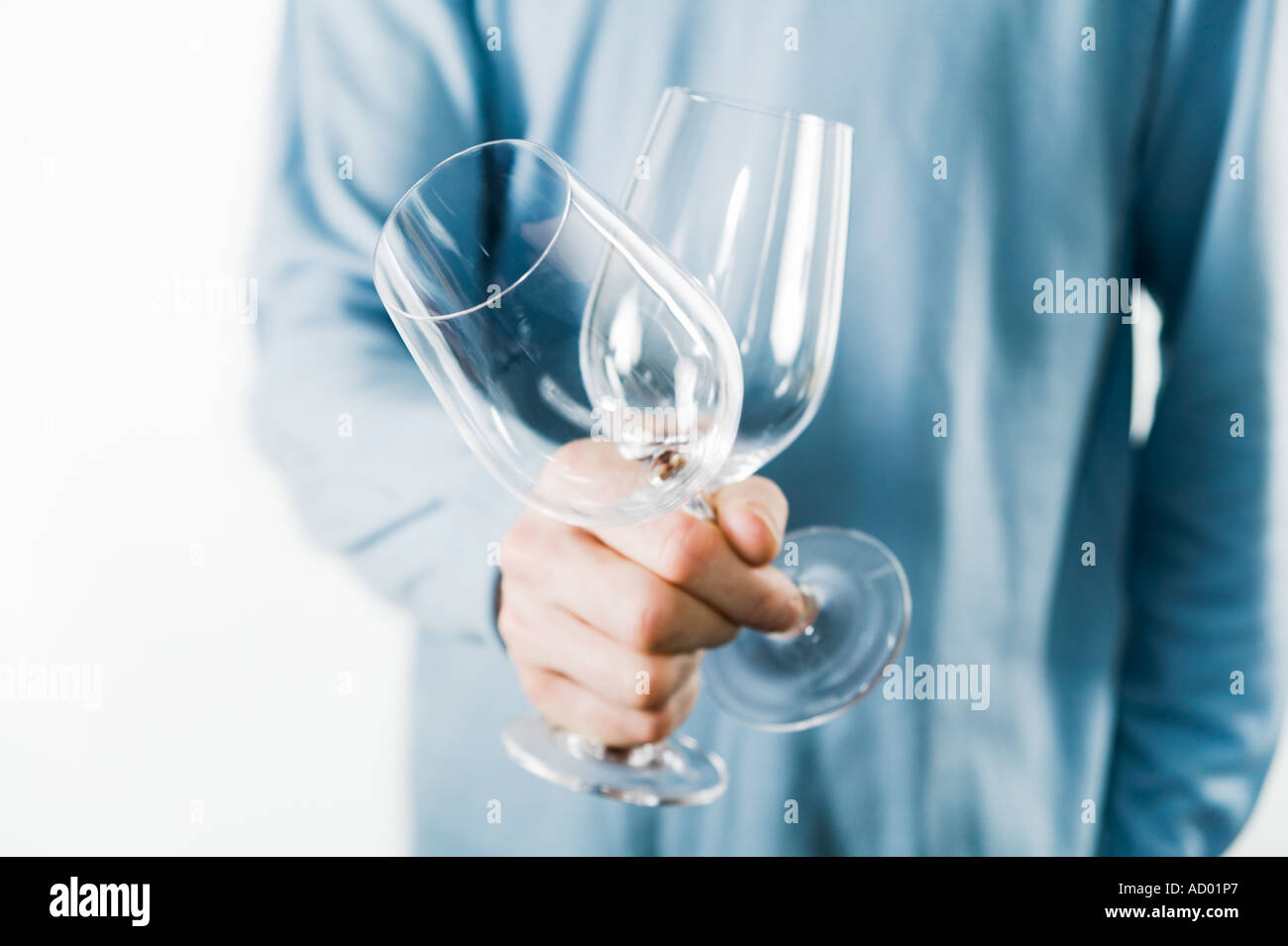 Man holding two empty wine glasses Stock Photo - Alamy