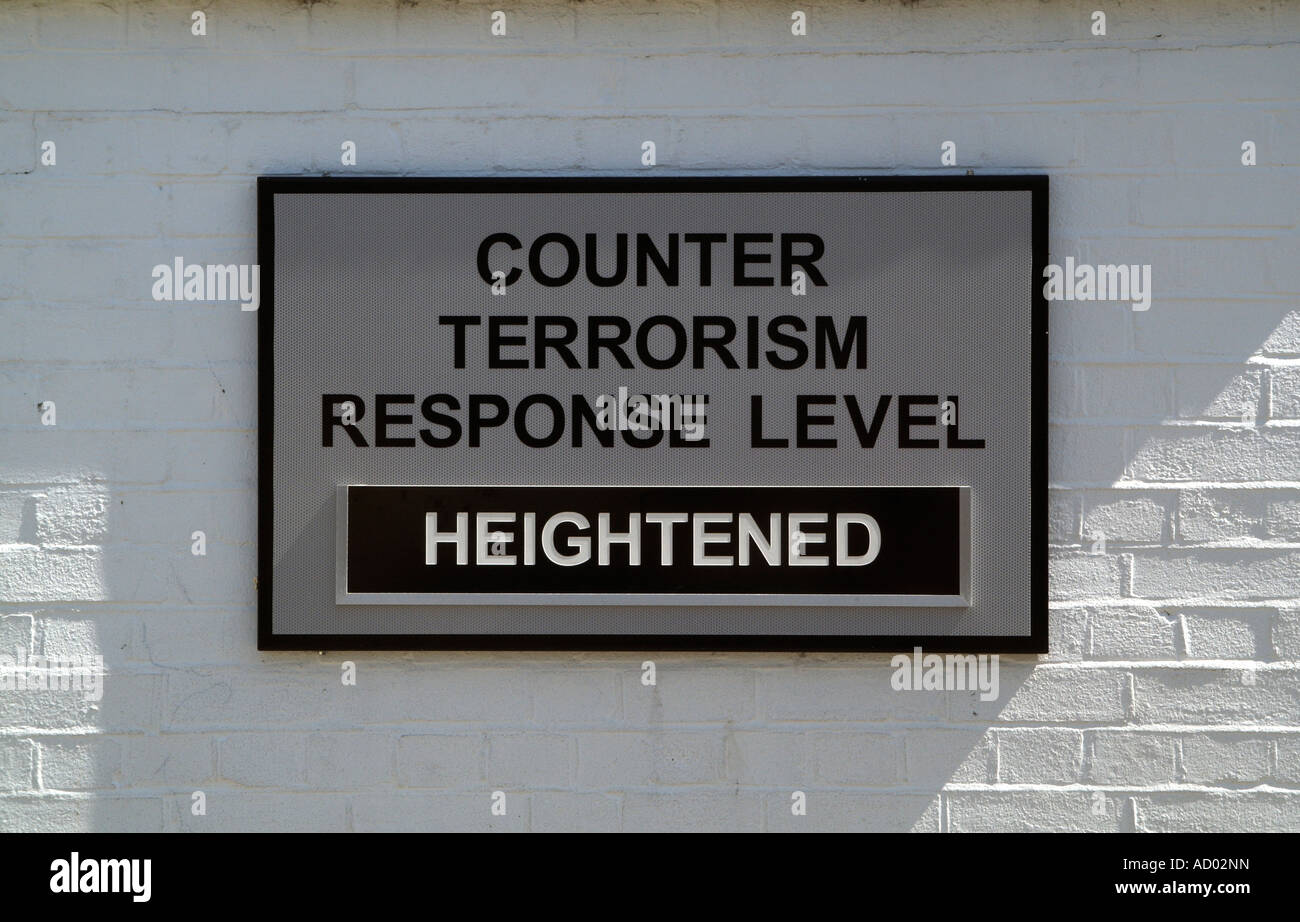 Security alert sign Counter Terrorism Response Level sign on a wall within a military establishment The sign reads Heightened Stock Photo