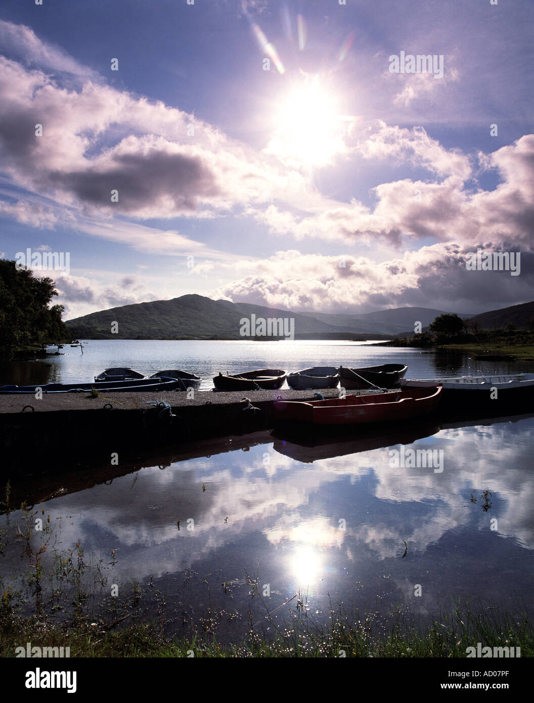 early morning reflections at daybreak on an irish fresh water lake Stock Photo