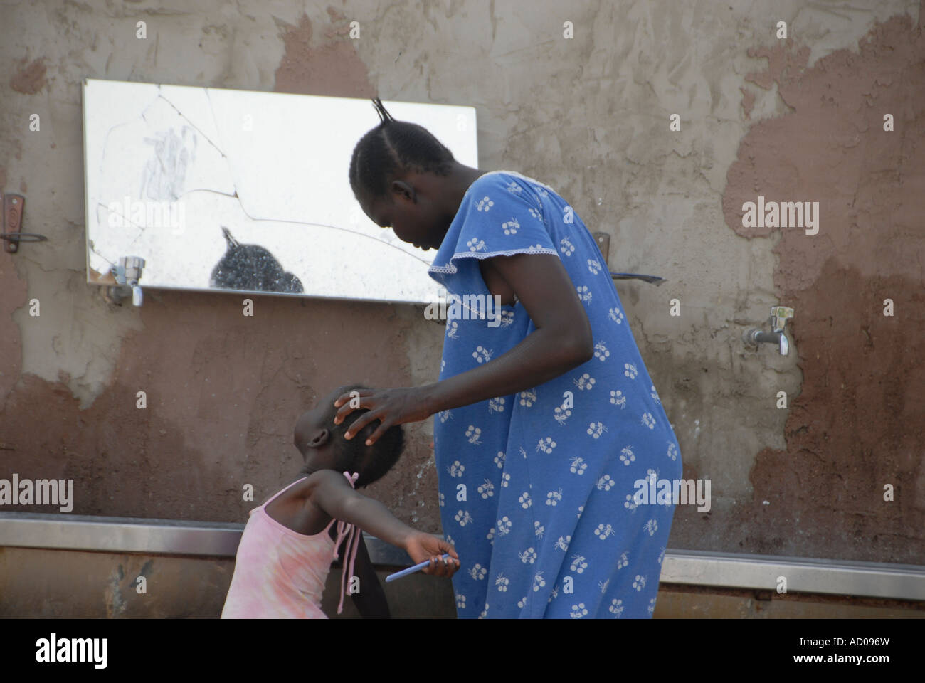 A Sudanese homeless at the backyard of Pinchas family in Kadesh Barnea kibbutz in the Negev desert after crossing from Egypt in southern Israel Stock Photo