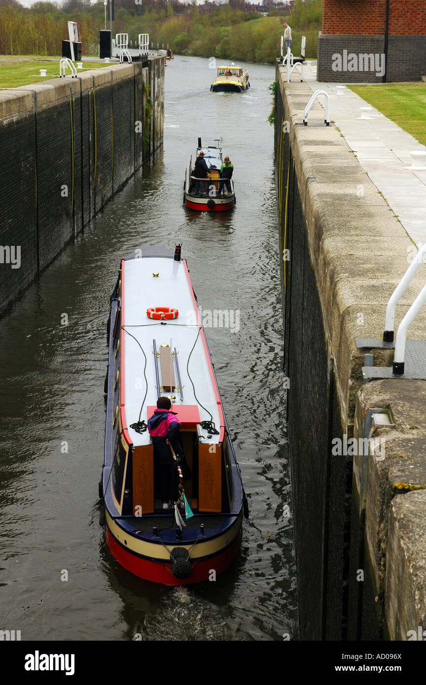 Narrowboats leaving Lemonroyd Lock Leeds West Yorkshire UK Stock Photo