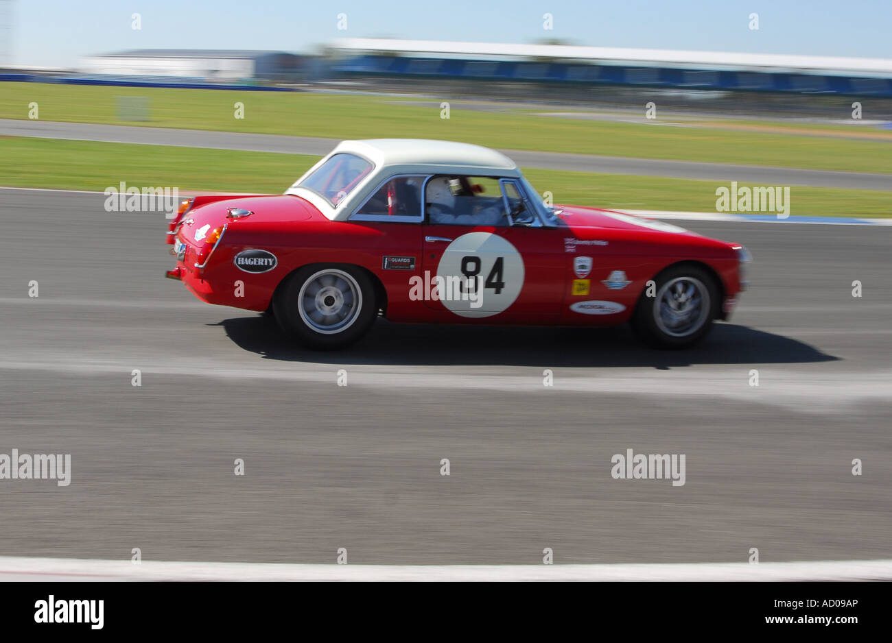 MGB historic racing car on track at Silverstone Stock Photo