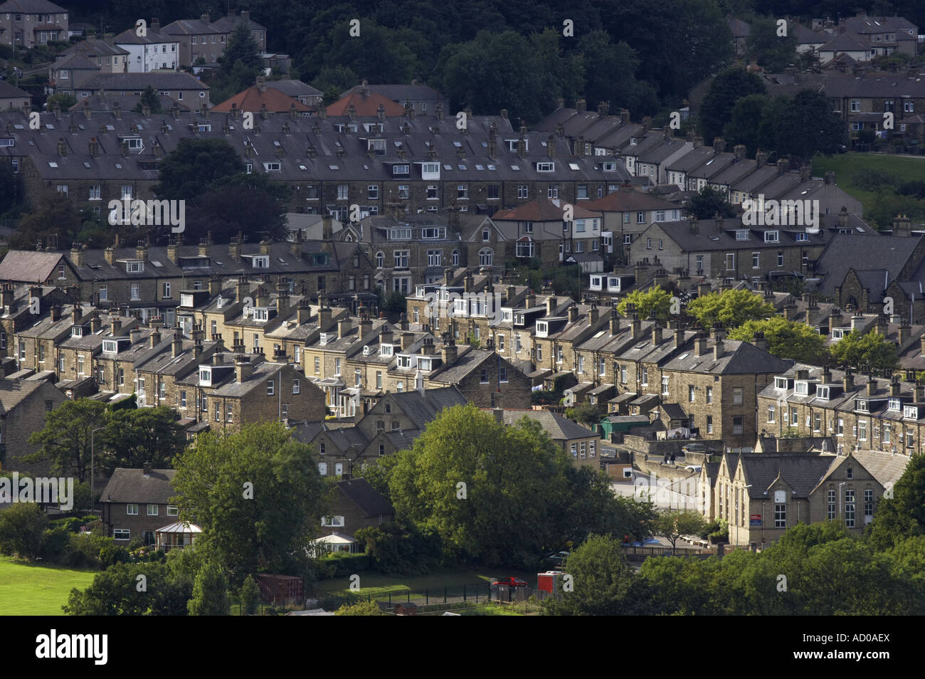 Elevated view over Shipley town rooftops (suburban stone-built terraced & semi-detached houses, mixed housing townscape) - West Yorkshire, England UK. Stock Photo