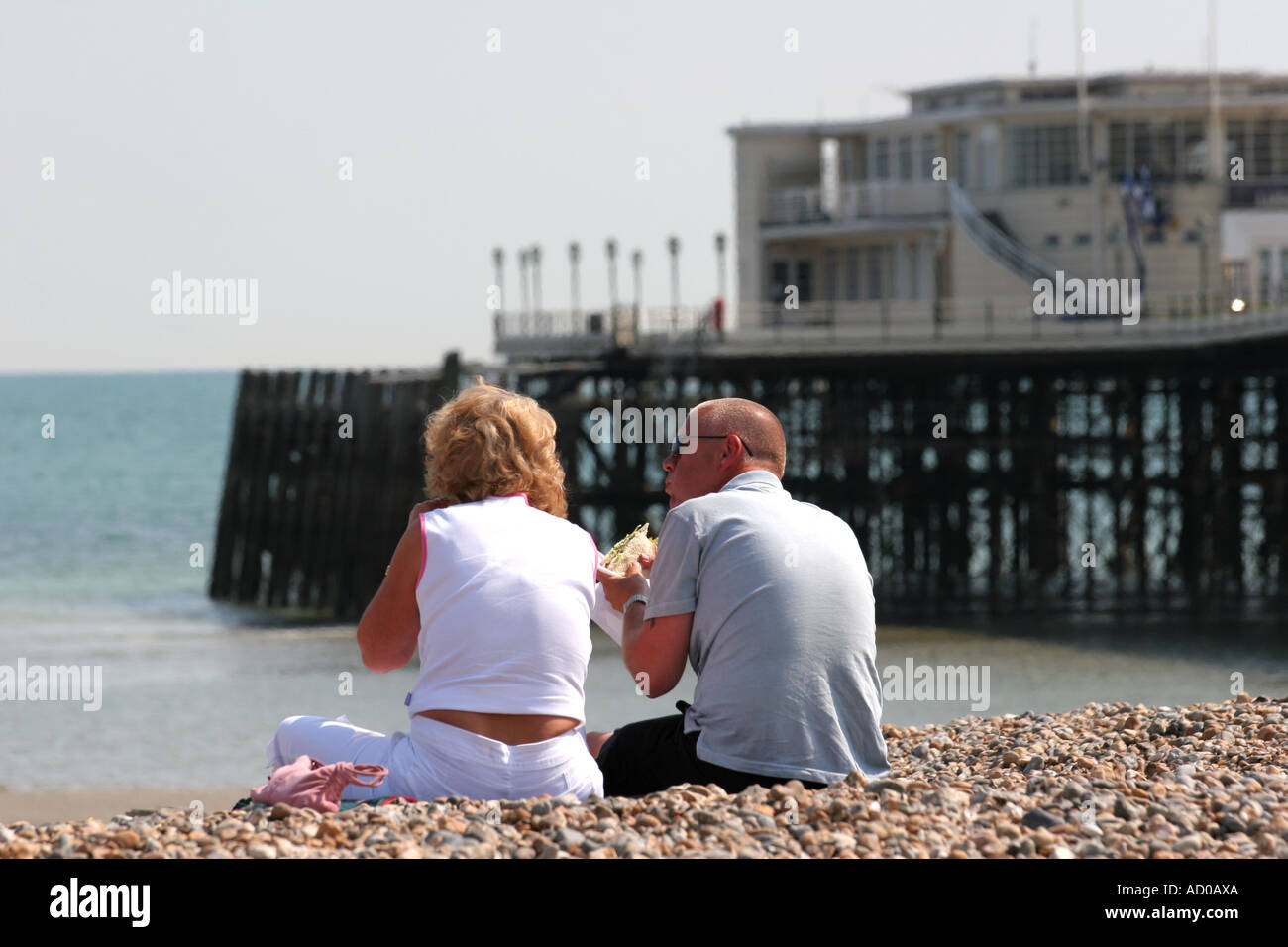couple enjoying beach picnic Stock Photo