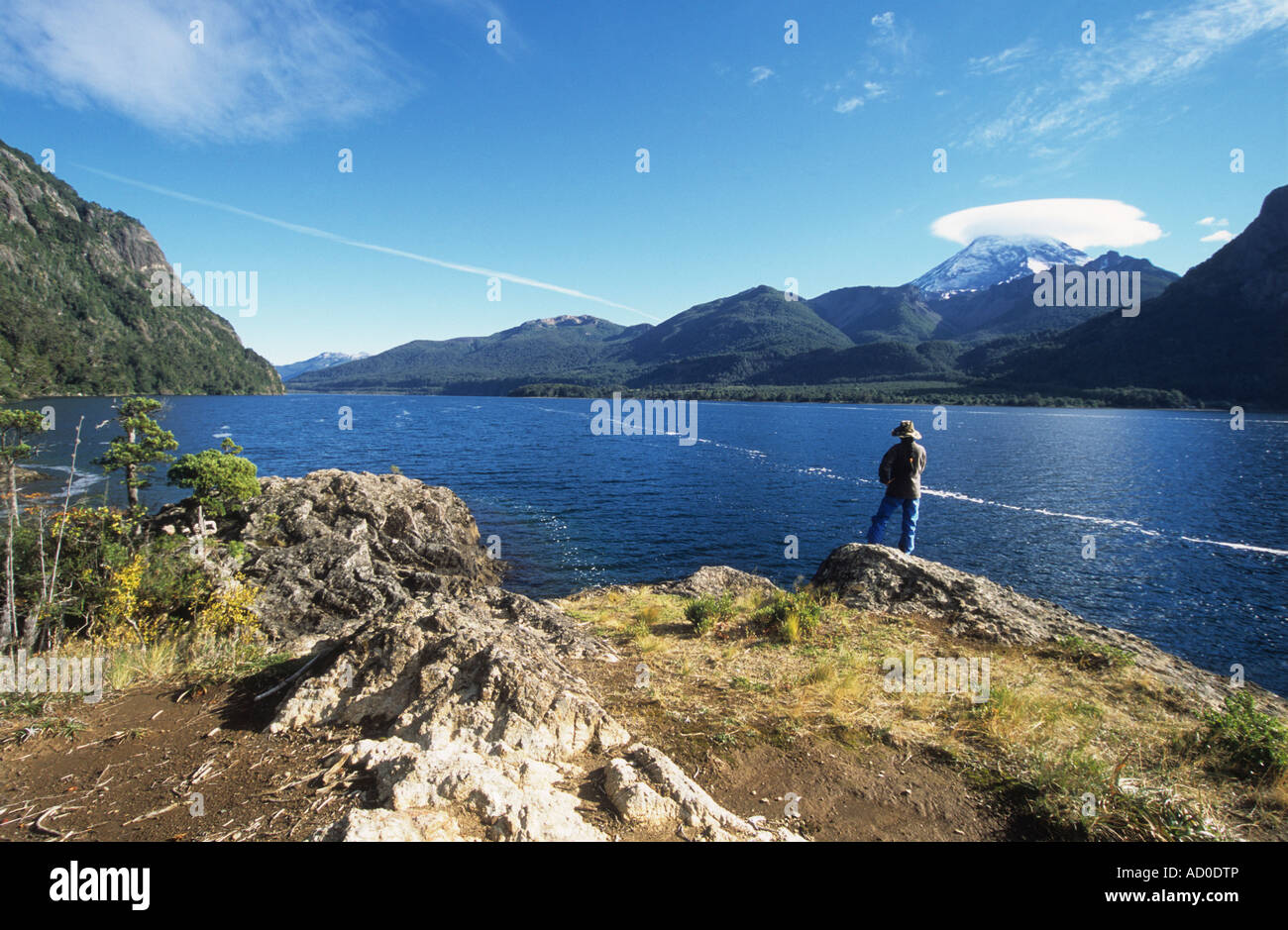 Trekker looking at view over Lake Paimun to Lanin volcano, Lanin National Park, Neuquen Province, Argentina Stock Photo