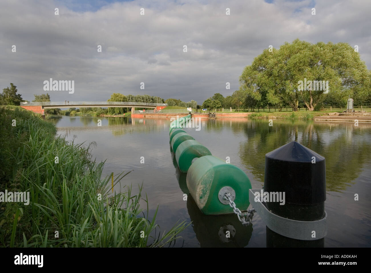Showing flotation buoys to stops boats going over the weir at Great Barford near Bedford on the River Great Ouse. Stock Photo