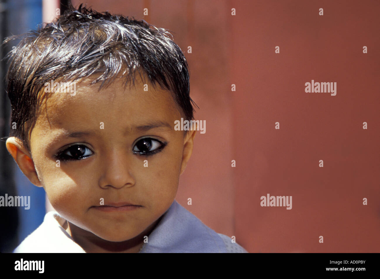 Young Muslim Boy with Eye Kohl, Jaipur, India Stock Photo