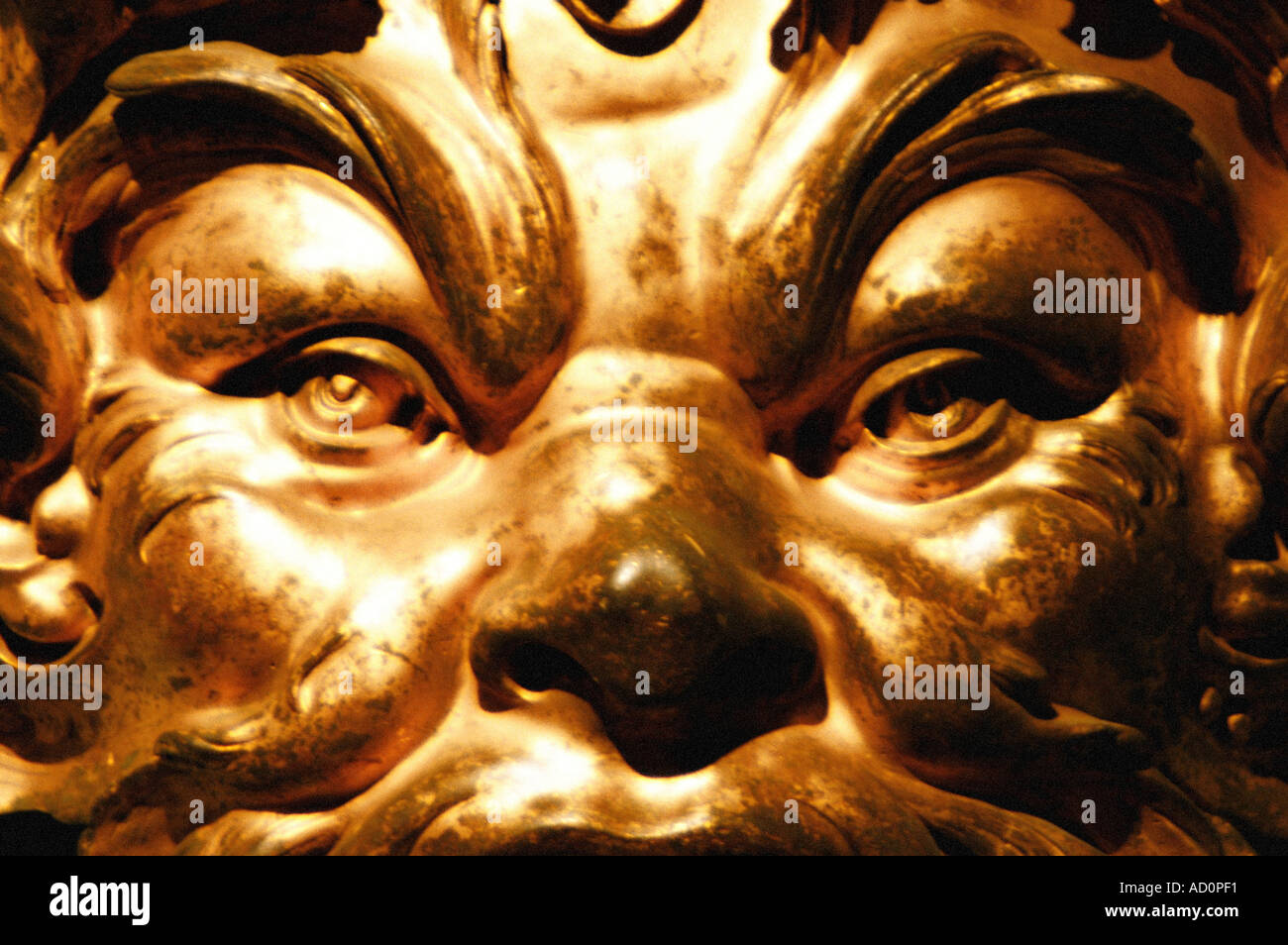Gilt bronze mask. France, early 18th century. Stock Photo
