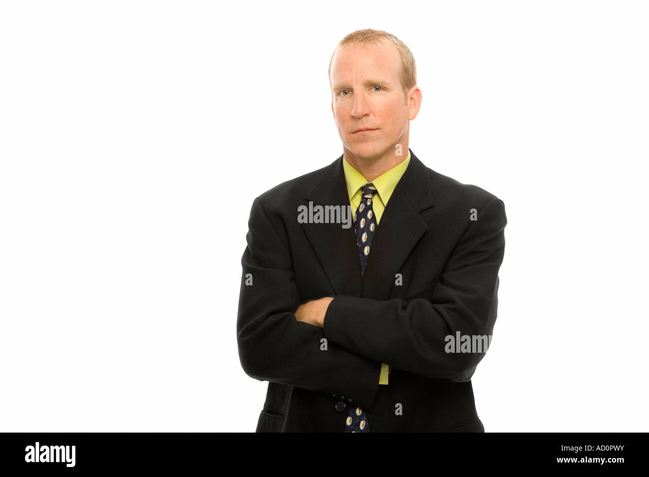 Man in suit stands arms hi-res stock photography and images - Alamy