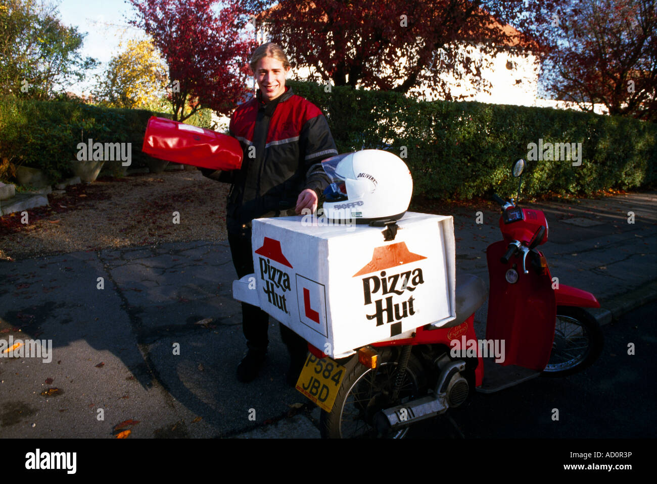 Pizza Hut Delivery Man and Motorbike Surrey England Stock Photo Alamy