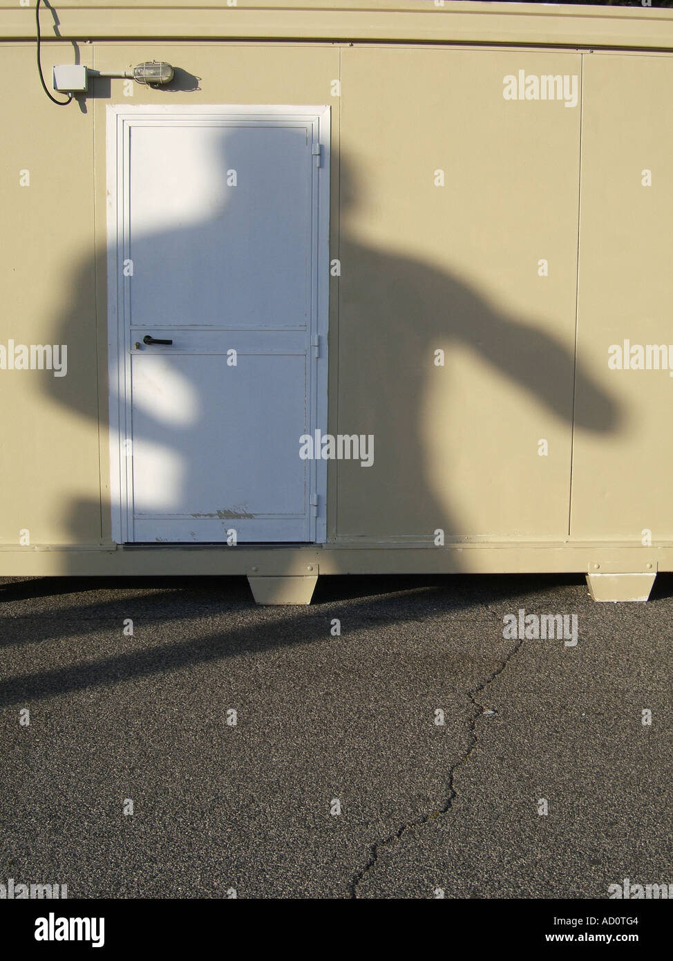 statue's shadow on portable cabin Stock Photo Alamy