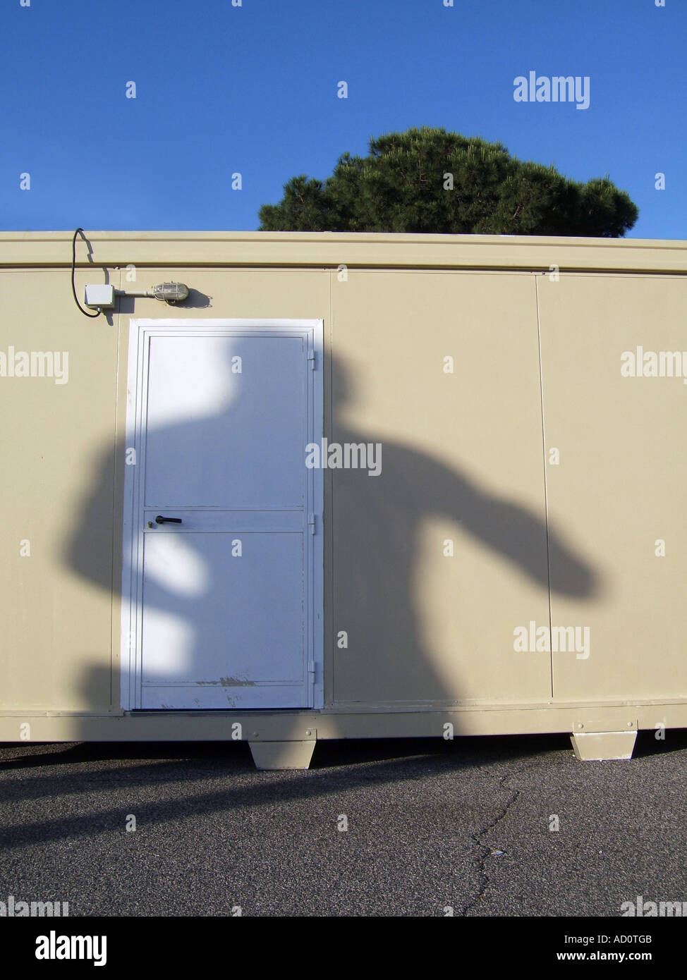 statue's shadow on portable cabin Stock Photo Alamy